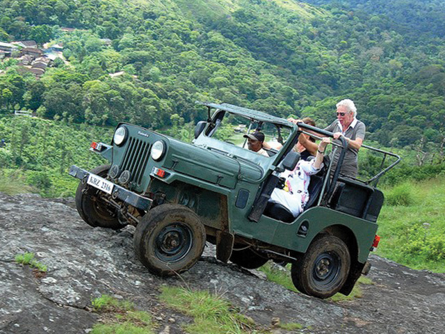 Jeep safari vehicle on a forest trail in Thekkady